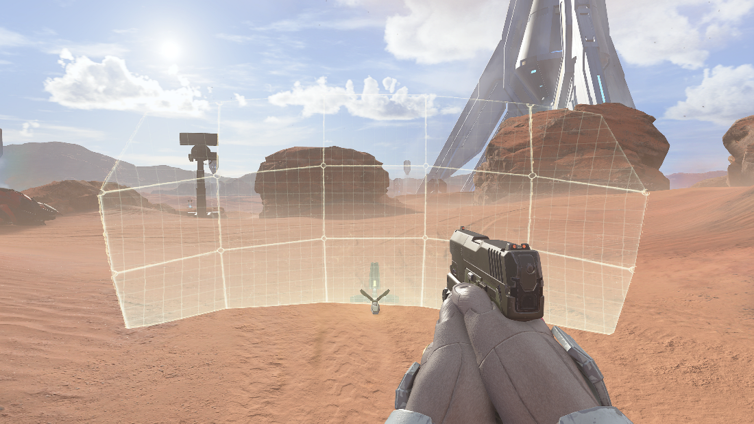 Player's perspective showing a Drop Wall in a desert landscape, with the generator at the bottom-middle poart of the wall.