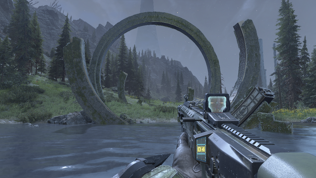 Players view looking at a Forerunner Artifact near a river with trees and mountains.